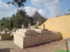 Modern graves in the shadows of the Pyramids.  Note trees, raised graves due to water table, etc.  These photos, pictures and pics will reveal far more than you ever expected.  Get the free book, The Solomon Series: Great Pyramid Mystery Resolved at www.SolomonSeries.com NOW!(Click here to view enlarged Photo)
